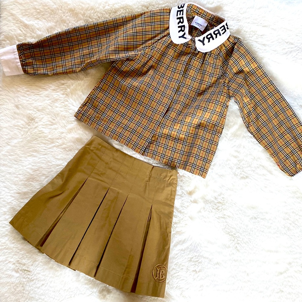 Button down BURBERRY plaid shirt with BURBERRY skirt.